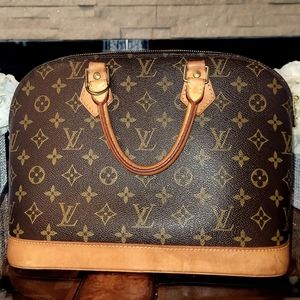 Authentic Alma MM handbag in Monogram canvas